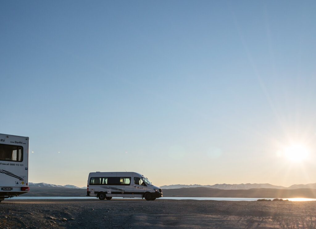back end of motorhome and campervan wide shot sunset