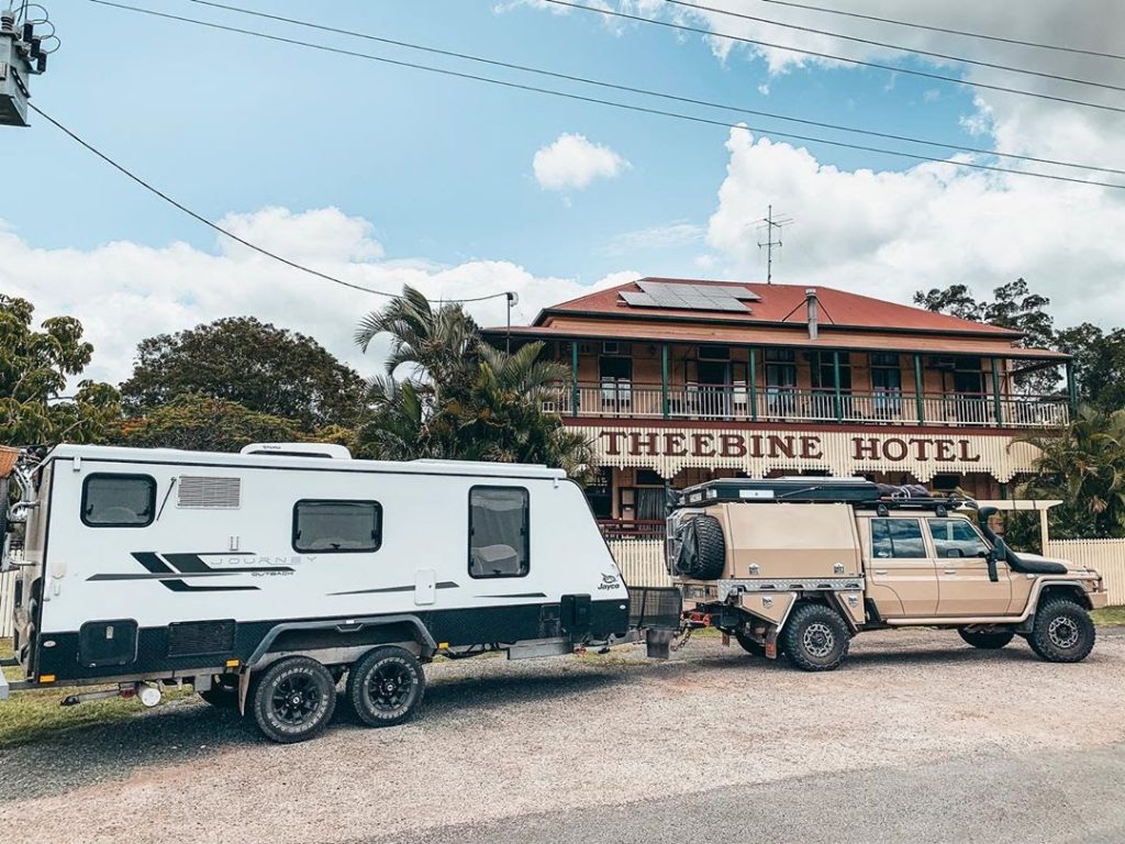 caravan hitched to a ute outside theebine hotel