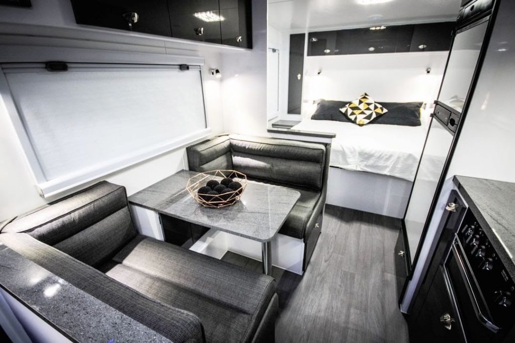 Interior shot of an RV with dark finishes