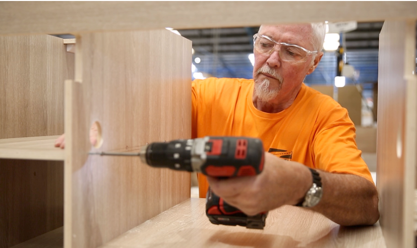 Man drilling and assembly interior of RV