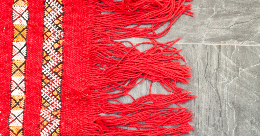 an image of red knitted rug in an RV