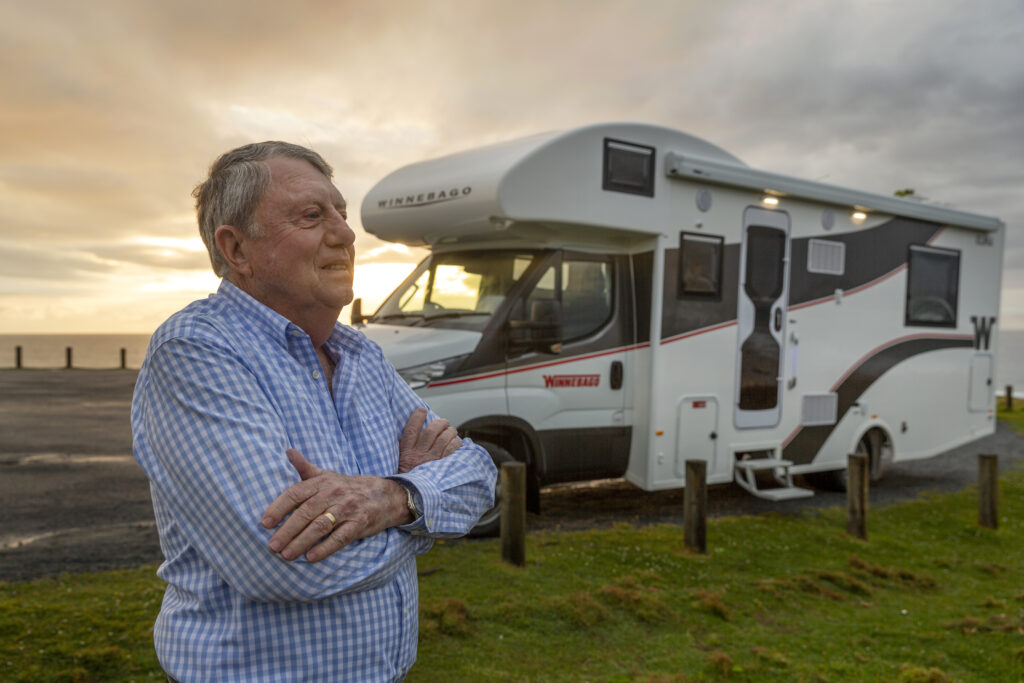 man standing in front of motorhome
